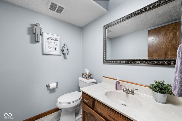 5412 Green Hills Dr, Brownsburg, IN 46112 - bathroom with vanity, toilet, tile patterned floors, baseboards, and a textured ceiling