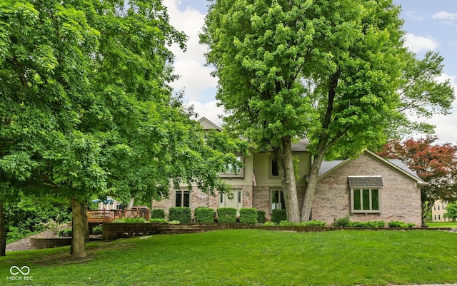 5412 Green Hills Dr, Brownsburg, IN 46112 - view of property hidden behind natural elements featuring a front lawn, brick siding, and a wooden deck