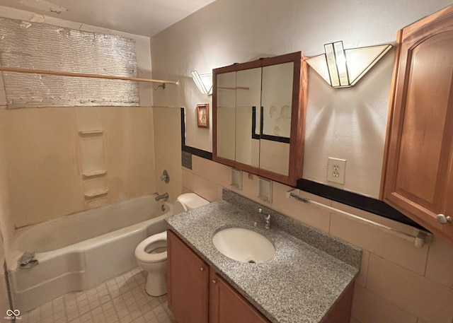 5472 E 10th St, Indianapolis, IN 46219 - bathroom featuring toilet, vanity, and tub / shower combination
