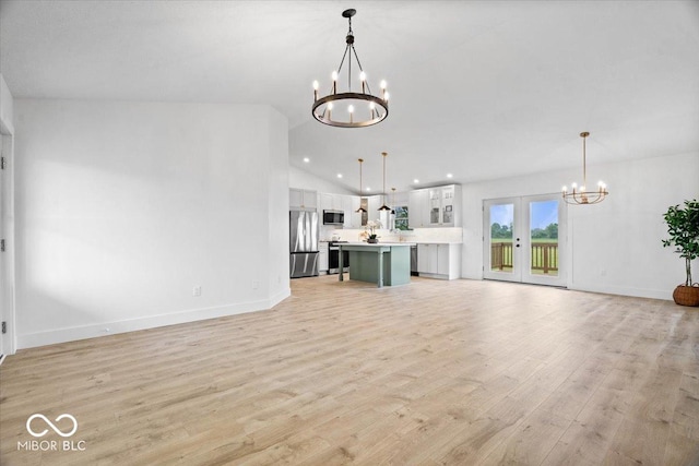 9605 W 100 S, Jamestown, IN 46147 - unfurnished living room with a chandelier, light wood finished floors, vaulted ceiling, baseboards, and recessed lighting
