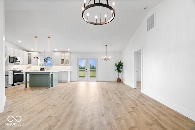 9605 W 100 S, Jamestown, IN 46147 - unfurnished living room with a chandelier, light wood-type flooring, french doors, recessed lighting, and baseboards