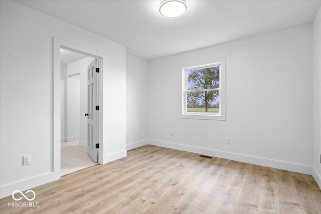 9605 W 100 S, Jamestown, IN 46147 - unfurnished bedroom with baseboards, light wood-style floors, and ensuite bath