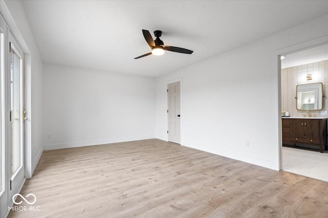 9605 W 100 S, Jamestown, IN 46147 - unfurnished bedroom featuring light wood-type flooring, ensuite bathroom, baseboards, and a ceiling fan