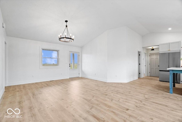 9605 W 100 S, Jamestown, IN 46147 - unfurnished living room with a chandelier, light wood-type flooring, baseboards, and high vaulted ceiling