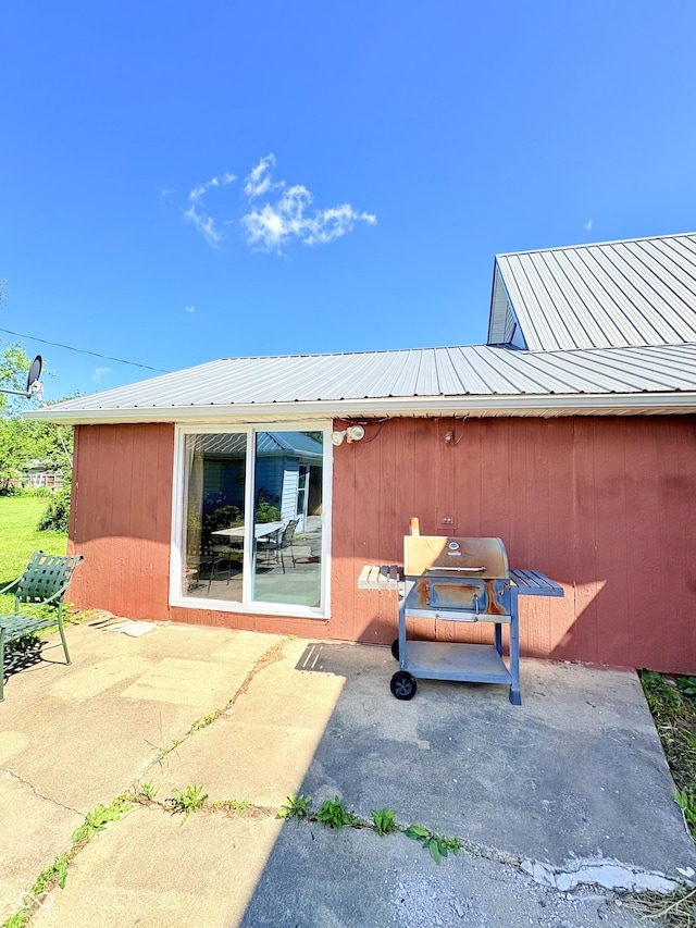 404 S Indiana St, Roachdale, IN 46172 - back of property featuring a patio area and metal roof