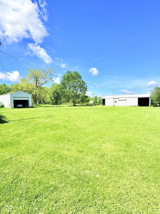 404 S Indiana St, Roachdale, IN 46172 - view of green lawn with an outbuilding and a garage