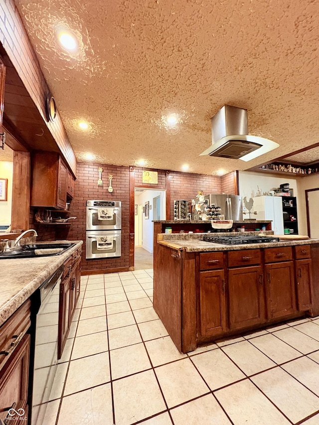 404 S Indiana St, Roachdale, IN 46172 - kitchen featuring a sink, light tile patterned floors, appliances with stainless steel finishes, and brown cabinetry