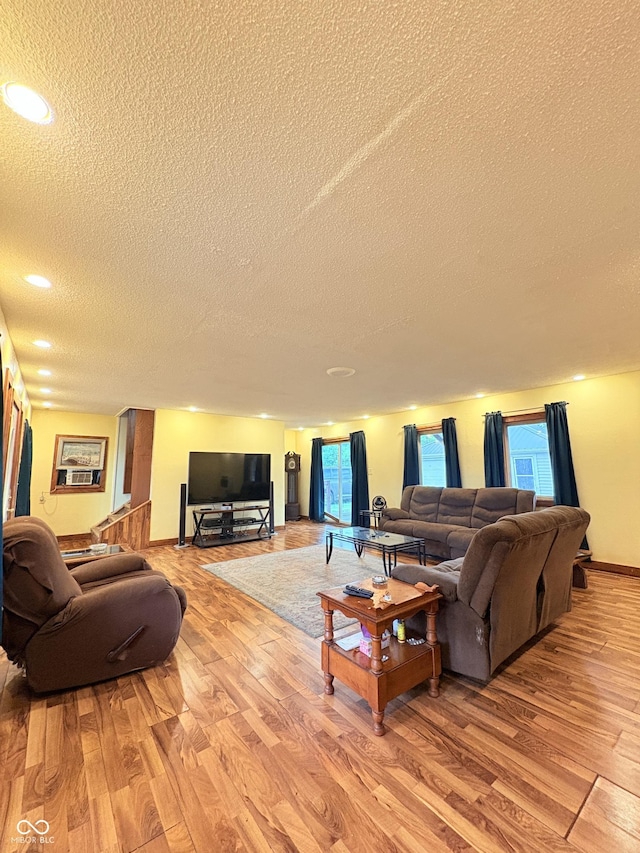 404 S Indiana St, Roachdale, IN 46172 - living room featuring a textured ceiling, light wood-style flooring, recessed lighting, and baseboards