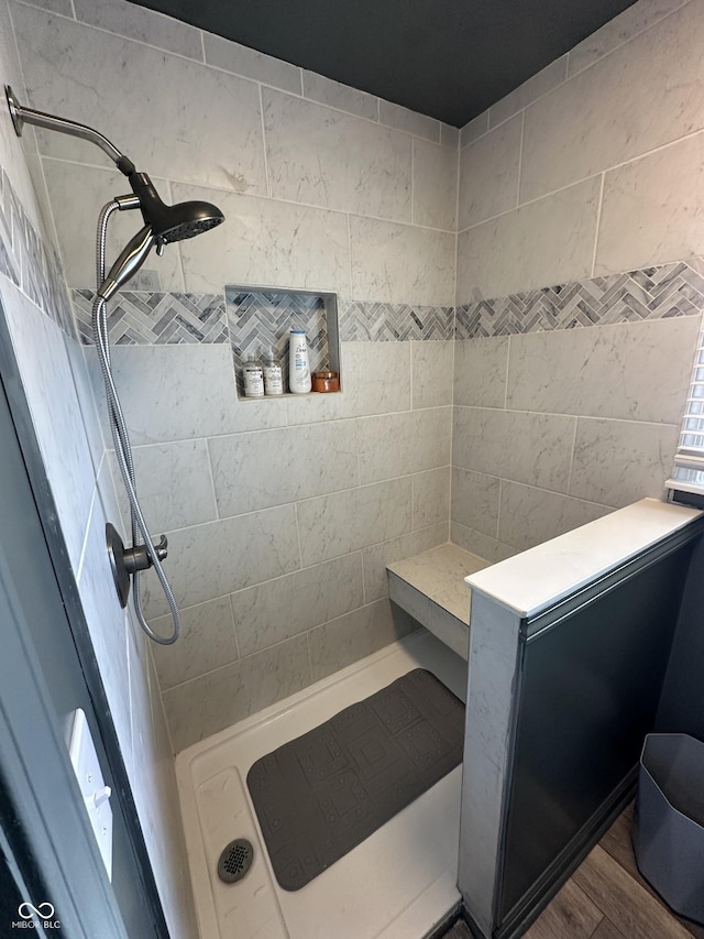 2028 Fairway Dr, Greencastle, IN 46135 - bathroom featuring a tile shower and wood finished floors