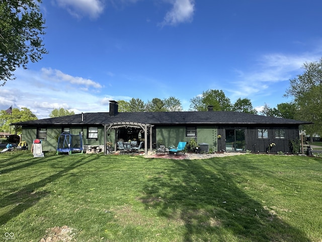 2028 Fairway Dr, Greencastle, IN 46135 - back of house with a lawn, a patio area, a chimney, and central AC unit