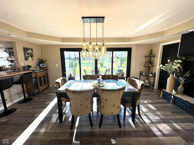 2028 Fairway Dr, Greencastle, IN 46135 - dining area featuring wood finished floors, baseboards, and a raised ceiling