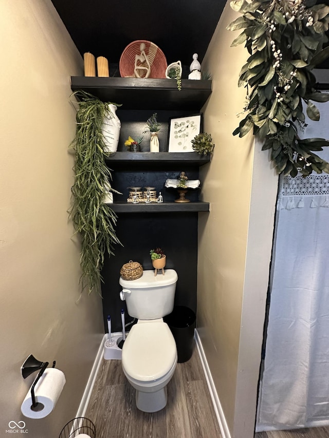 2028 Fairway Dr, Greencastle, IN 46135 - full bathroom featuring toilet, wood finished floors, baseboards, and a shower with curtain