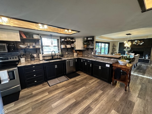 2028 Fairway Dr, Greencastle, IN 46135 - kitchen featuring open shelves, a sink, dark cabinets, stainless steel appliances, and decorative backsplash