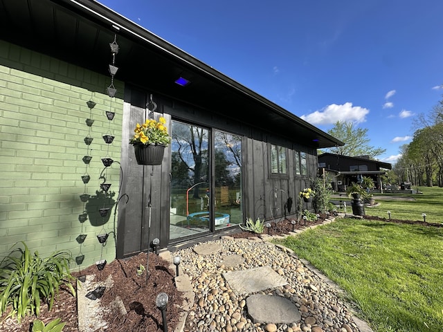 2028 Fairway Dr, Greencastle, IN 46135 - view of property exterior featuring a lawn and brick siding