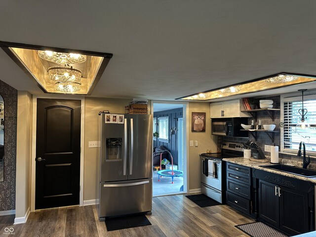 2028 Fairway Dr, Greencastle, IN 46135 - kitchen featuring appliances with stainless steel finishes, a sink, dark wood finished floors, baseboards, and a chandelier