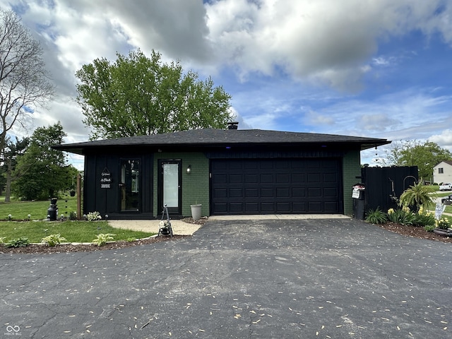2028 Fairway Dr, Greencastle, IN 46135 - view of front of property featuring asphalt driveway, brick siding, and a garage