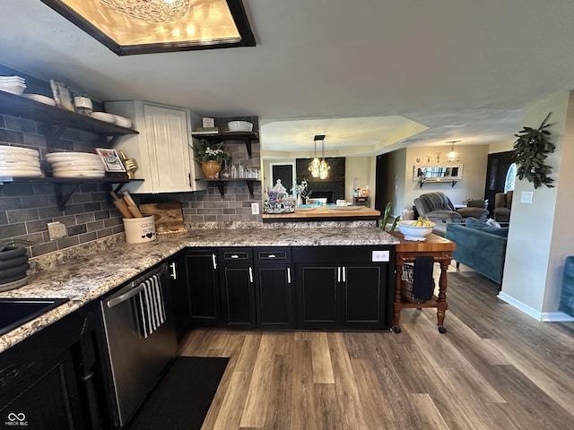 2028 Fairway Dr, Greencastle, IN 46135 - kitchen featuring open shelves, dark cabinets, light wood-style flooring, a tray ceiling, and backsplash
