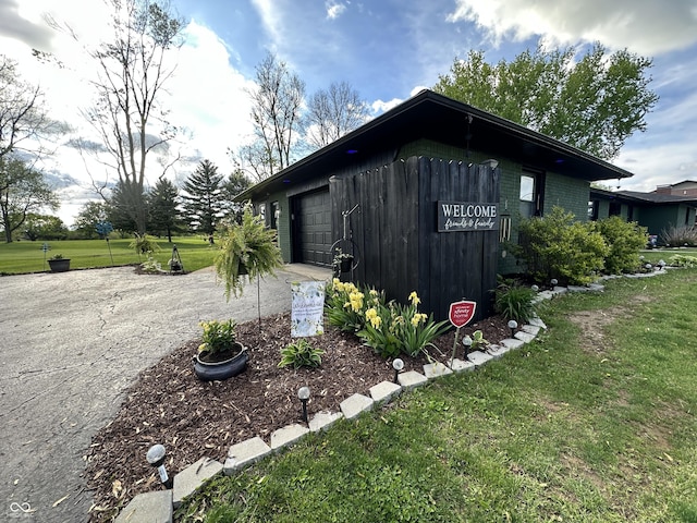2028 Fairway Dr, Greencastle, IN 46135 - view of property exterior featuring driveway and a yard