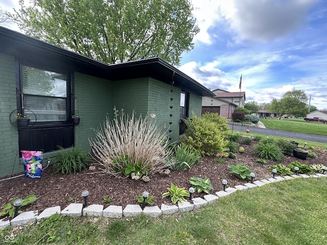 2028 Fairway Dr, Greencastle, IN 46135 - view of property exterior featuring brick siding, a yard, and a garage