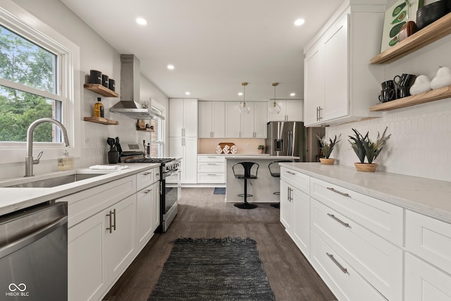 3526 Westfield Dr, Anderson, IN 46011 - kitchen featuring open shelves, appliances with stainless steel finishes, wall chimney range hood, a sink, and dark wood-style flooring