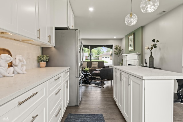 3526 Westfield Dr, Anderson, IN 46011 - kitchen featuring white cabinets, light stone counters, and a fireplace