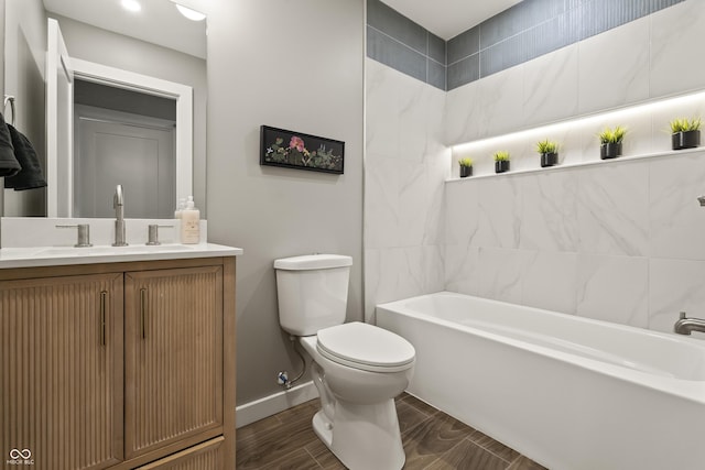 3526 Westfield Dr, Anderson, IN 46011 - full bathroom with a bathtub, toilet, vanity, baseboards, and wood tiled floors