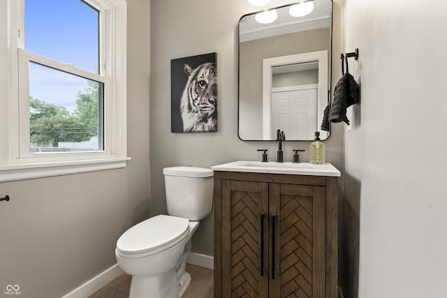 3526 Westfield Dr, Anderson, IN 46011 - half bath with baseboards, toilet, and vanity