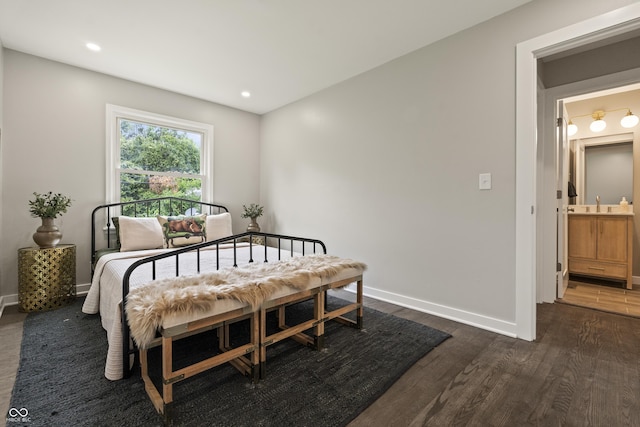 3526 Westfield Dr, Anderson, IN 46011 - bedroom with dark wood-style flooring, baseboards, a sink, and recessed lighting
