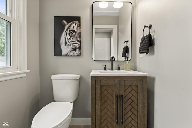 3526 Westfield Dr, Anderson, IN 46011 - half bathroom with toilet, vanity, and baseboards