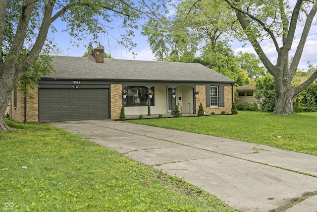 3526 Westfield Dr, Anderson, IN 46011 - ranch-style home featuring a garage, brick siding, driveway, and a front lawn