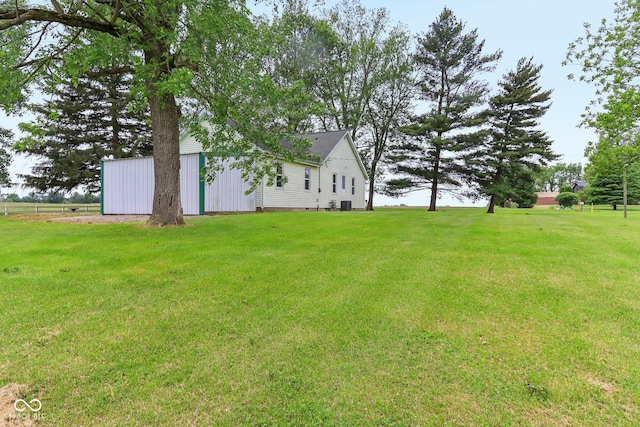 6012 S 625 W, Pendleton, IN 46064 - view of green lawn with a pole building, an outdoor structure, and central AC