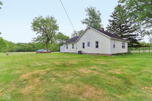 6012 S 625 W, Pendleton, IN 46064 - back of property featuring a chimney, a lawn, and central air condition unit