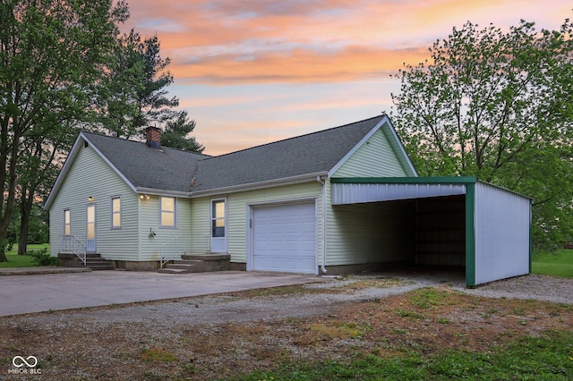 6012 S 625 W, Pendleton, IN 46064 - view of front facade with driveway, a chimney, and a shingled roof