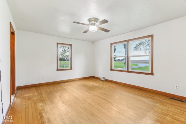6012 S 625 W, Pendleton, IN 46064 - empty room with healthy amount of natural light, ceiling fan, light wood-style flooring, and baseboards