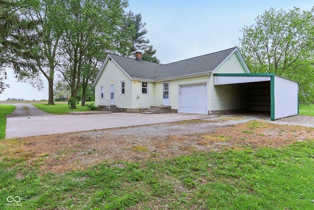 6012 S 625 W, Pendleton, IN 46064 - view of home's exterior featuring driveway, a chimney, an attached garage, and roof with shingles