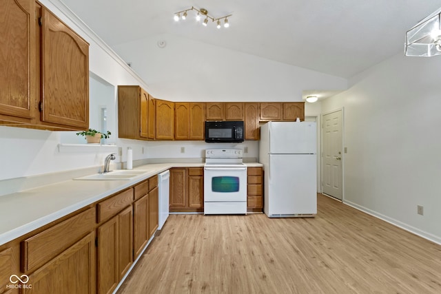 975 Atir Ln, Greenfield, IN 46140 - kitchen with white appliances, a sink, lofted ceiling, brown cabinetry, and light wood-style floors