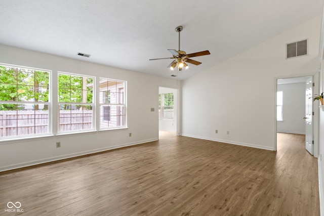 975 Atir Ln, Greenfield, IN 46140 - empty room with a ceiling fan, wood finished floors, lofted ceiling, and baseboards