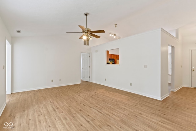 975 Atir Ln, Greenfield, IN 46140 - unfurnished living room with a ceiling fan, light wood-type flooring, lofted ceiling, and baseboards