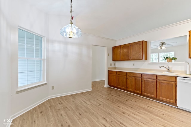 975 Atir Ln, Greenfield, IN 46140 - kitchen featuring a sink, dishwasher, brown cabinets, lofted ceiling, and light wood-style flooring