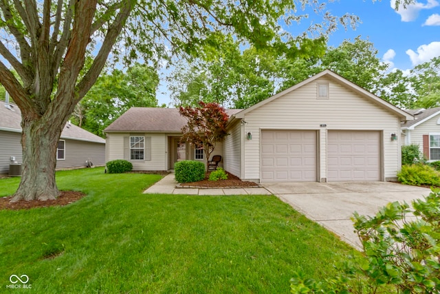 975 Atir Ln, Greenfield, IN 46140 - view of front of home featuring an attached garage, driveway, cooling unit, and a front yard