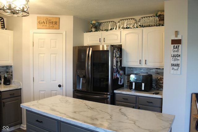 5101 W Bay Rd, Plainfield, IN 46168 - kitchen featuring stainless steel fridge with ice dispenser, gray cabinetry, tasteful backsplash, and a textured ceiling