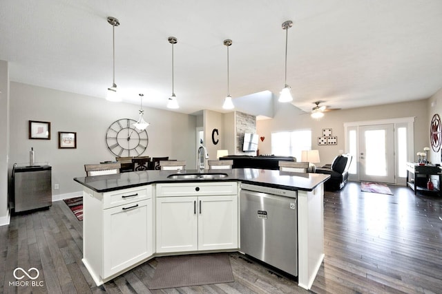217 N Liberty Blvd, Mooresville, IN 46158 - kitchen featuring stainless steel dishwasher, a sink, open floor plan, dark countertops, and a ceiling fan