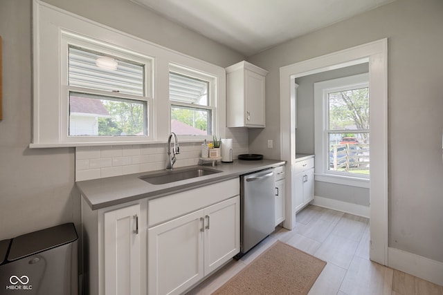 536 S 27th St, Lafayette, IN 47904 - kitchen featuring a sink, dishwasher, backsplash, and plenty of natural light