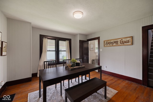 536 S 27th St, Lafayette, IN 47904 - dining area with baseboards, wood finished floors, and a textured ceiling