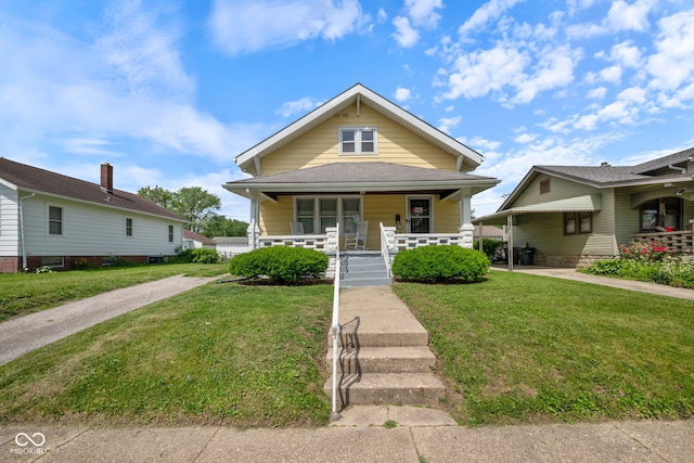 536 S 27th St, Lafayette, IN 47904 - view of front facade featuring covered porch and a front lawn