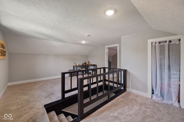 536 S 27th St, Lafayette, IN 47904 - staircase featuring carpet floors, lofted ceiling, a textured ceiling, and baseboards
