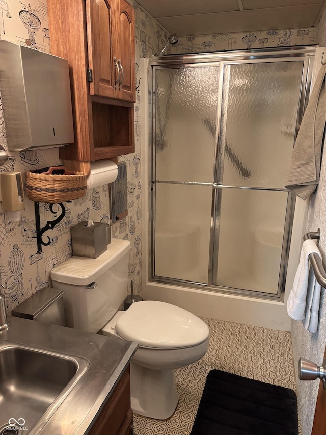 505 N Edward Dr, Greensburg, IN 47240 - bathroom featuring wallpapered walls, toilet, an enclosed shower, and vanity