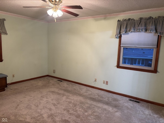 505 N Edward Dr, Greensburg, IN 47240 - carpeted spare room featuring ceiling fan, a textured ceiling, crown molding, and baseboards