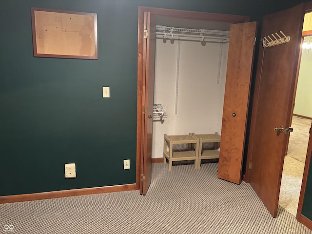 505 N Edward Dr, Greensburg, IN 47240 - unfurnished bedroom featuring a closet, baseboards, and carpet floors