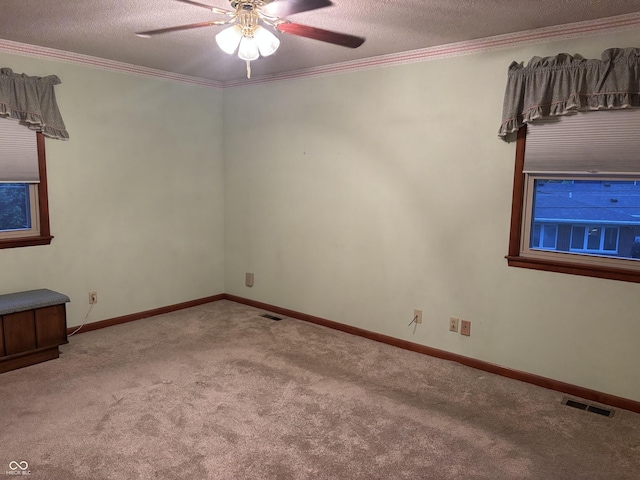 505 N Edward Dr, Greensburg, IN 47240 - carpeted spare room featuring ceiling fan, crown molding, a textured ceiling, and baseboards